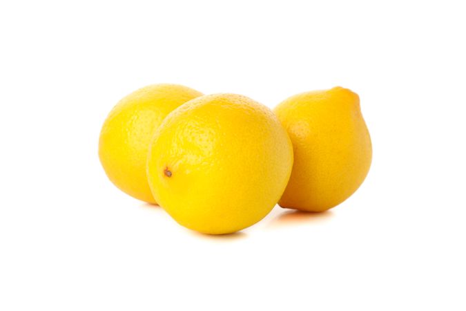 Fresh lemons isolated on light background. Ripe fruit