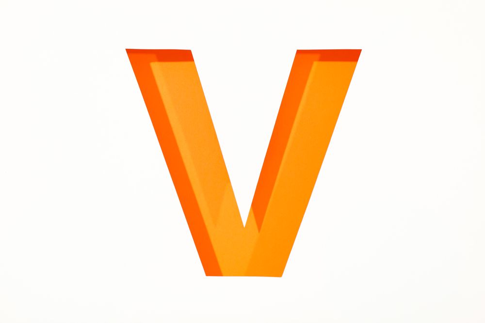 Color letter V on blank background, space for text