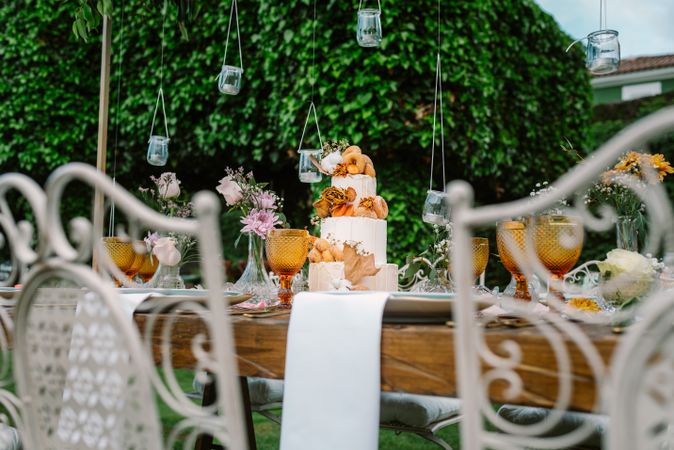 Wedding table decoration in rustic style placed outdoors
