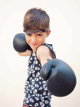 Sporty boy with boxing gloves