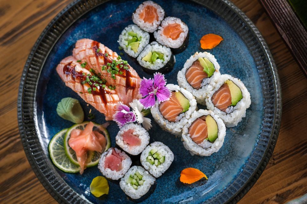 Plate with assorted sushi served with wasabi and ginger