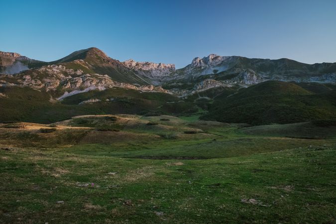 Majestic mountains against blue sky in sunny day