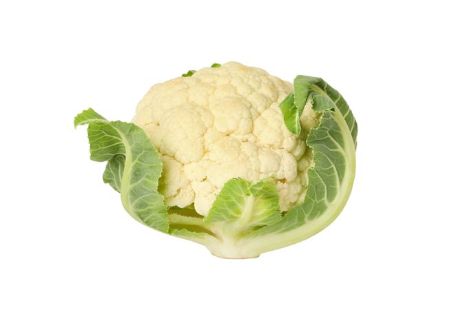 Whole cauliflower with leaves, isolated on plain background