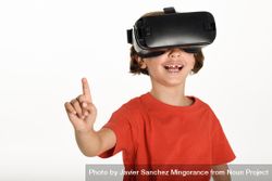 Smiling girl looking in VR glasses and gesturing with finger pointing up 4BX8d0