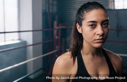 Portrait of female athlete in boxing ring 4AzG8W