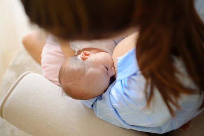 A woman holding a baby in her arms