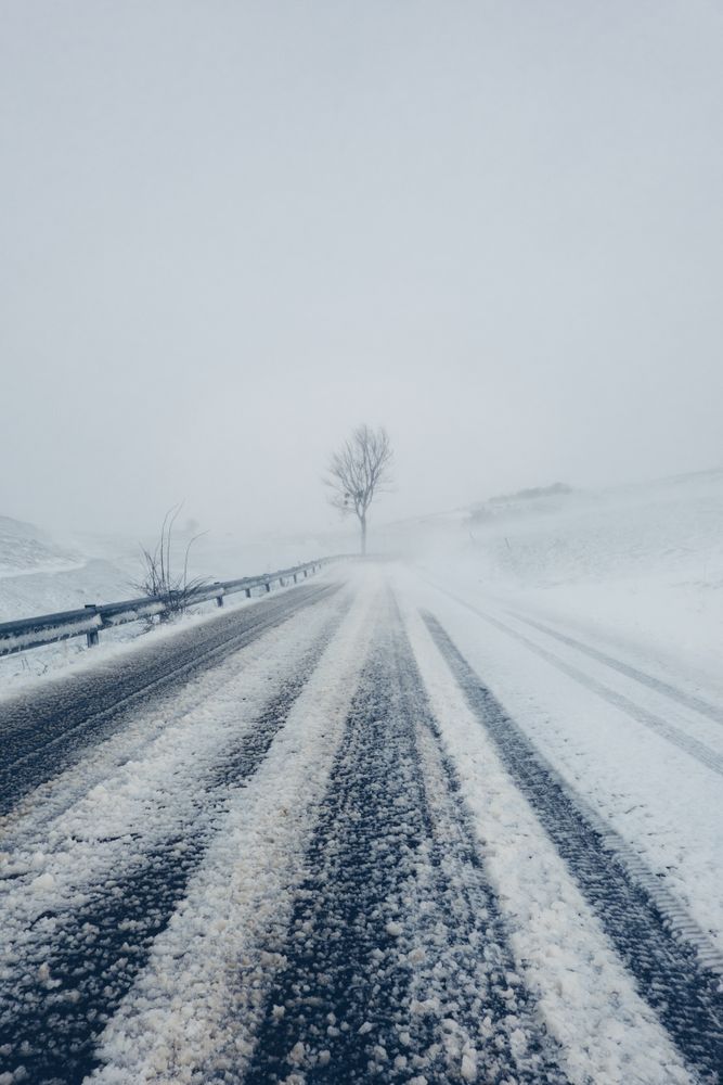 Winter snowy empty country road