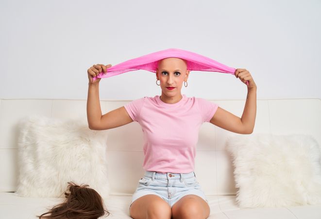 a woman suffering from cancer wearing a hairless headscarf for chemotherapy medical treatment