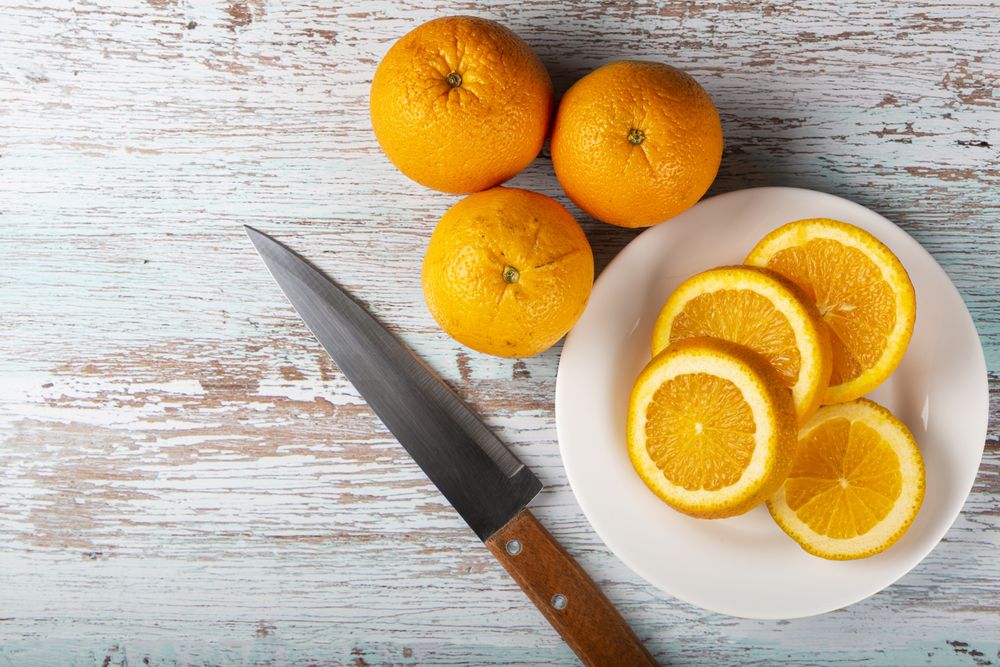 Sliced oranges on the table.