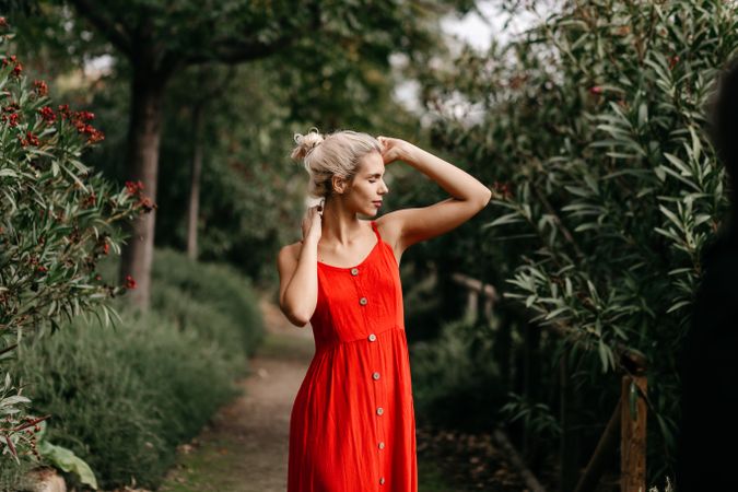Dreamy young woman in summer garden