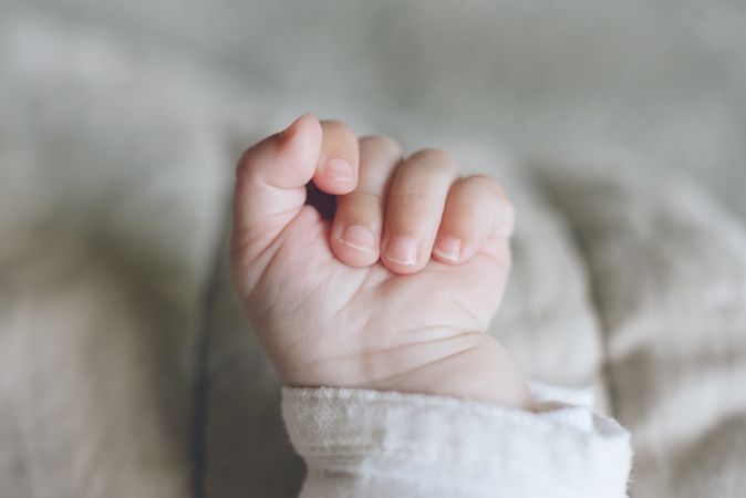 Charming cute baby hand and fingers of new born