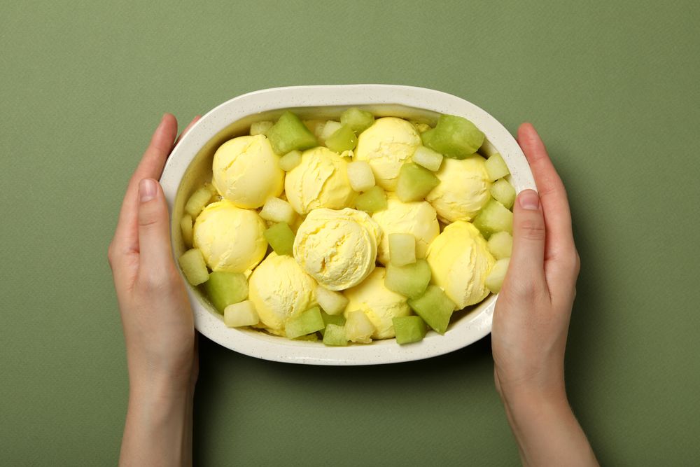Ice cream with fresh melon in a bowl