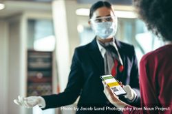 Woman traveler using digital vaccination certificate for travel during covid-19 pandemic 0JkQN5