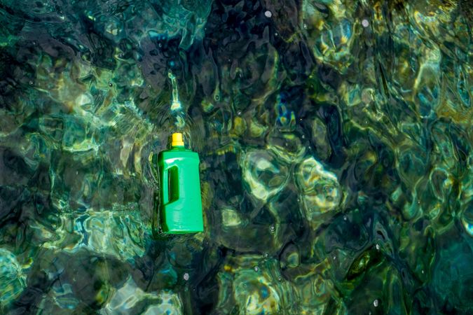 Plastic bottle floating on water