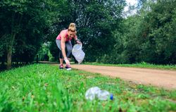 Females picking up trash doing plogging