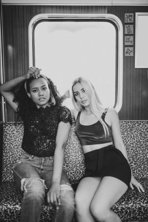 Cheerful friends in train car