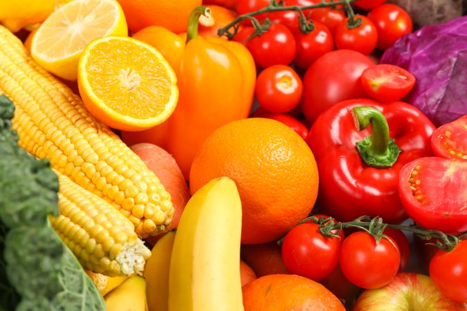 Ripe vegetables and fruits on whole background, close up
