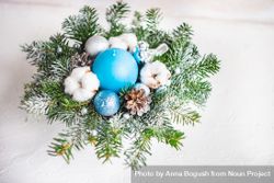 Christmas wreath with blue baubles and pines on table 5lajM4