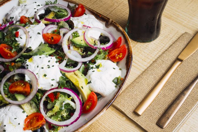 Vegetables salad with onion greens and cream sauce