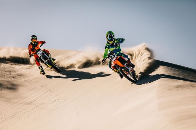 Dirt bikers in action in desert
