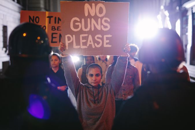 Activists demonstrating to ban weapons at night