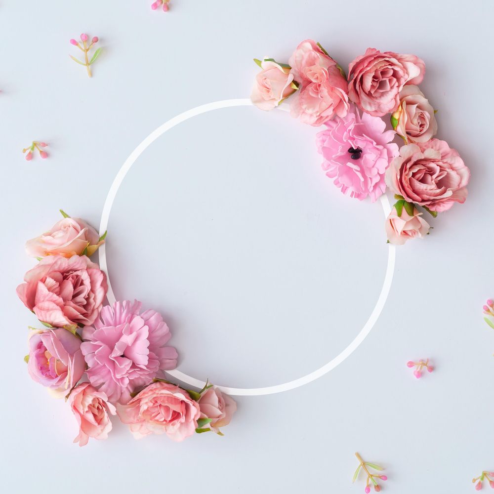 Creative layout made of colorful spring flowers and illuminated circle