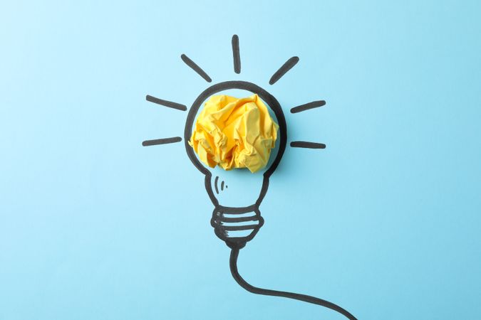 Drawn light bulb on blue background. Good idea concept