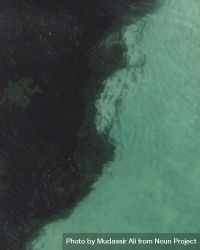 Aerial shot of where shallow sea meets dark trench 4dX1l4