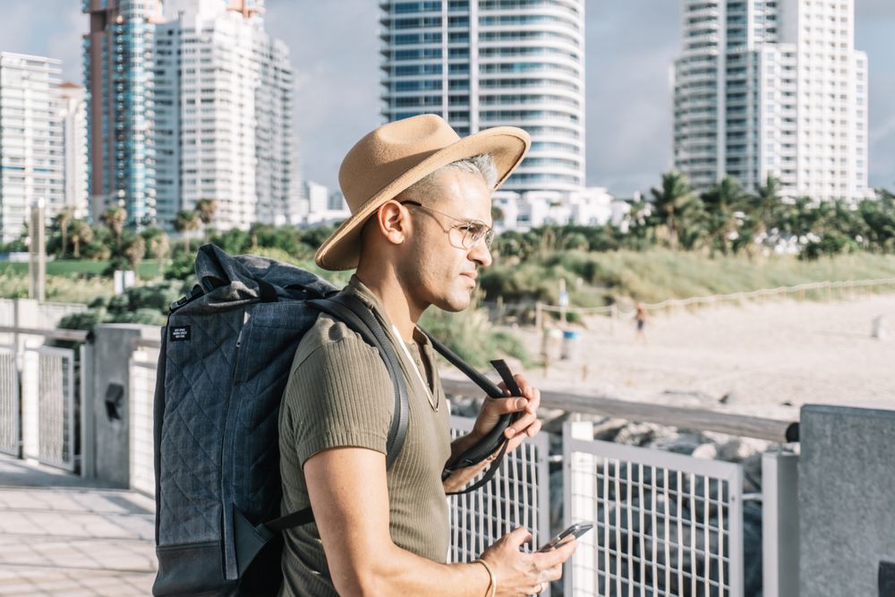 Profile, young man with a backpack