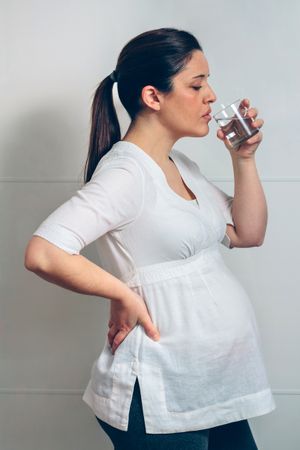 Pregnant woman drinking water