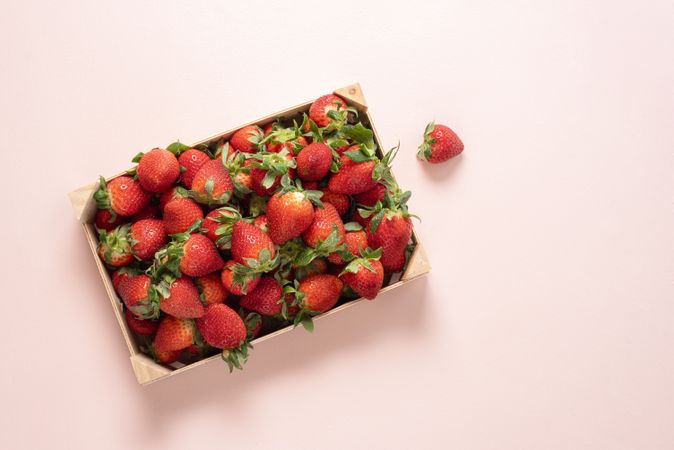 Top view of strawberries in a wooden box