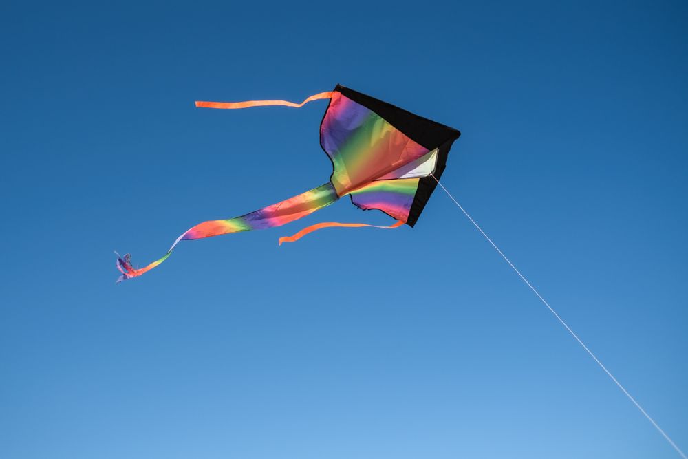 Colorful kite in blue sky