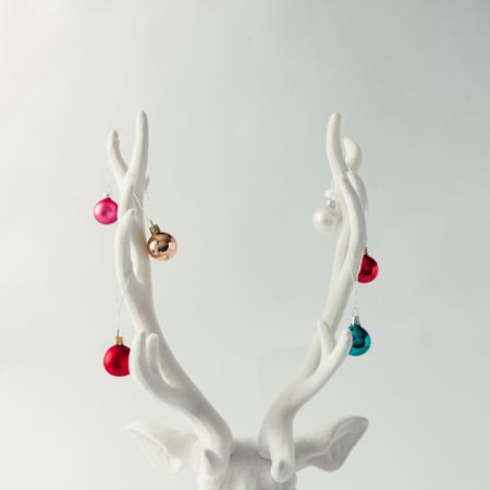 Christmas reindeer head with antlers with baubles