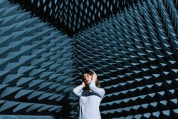 Woman in sound room listening to music