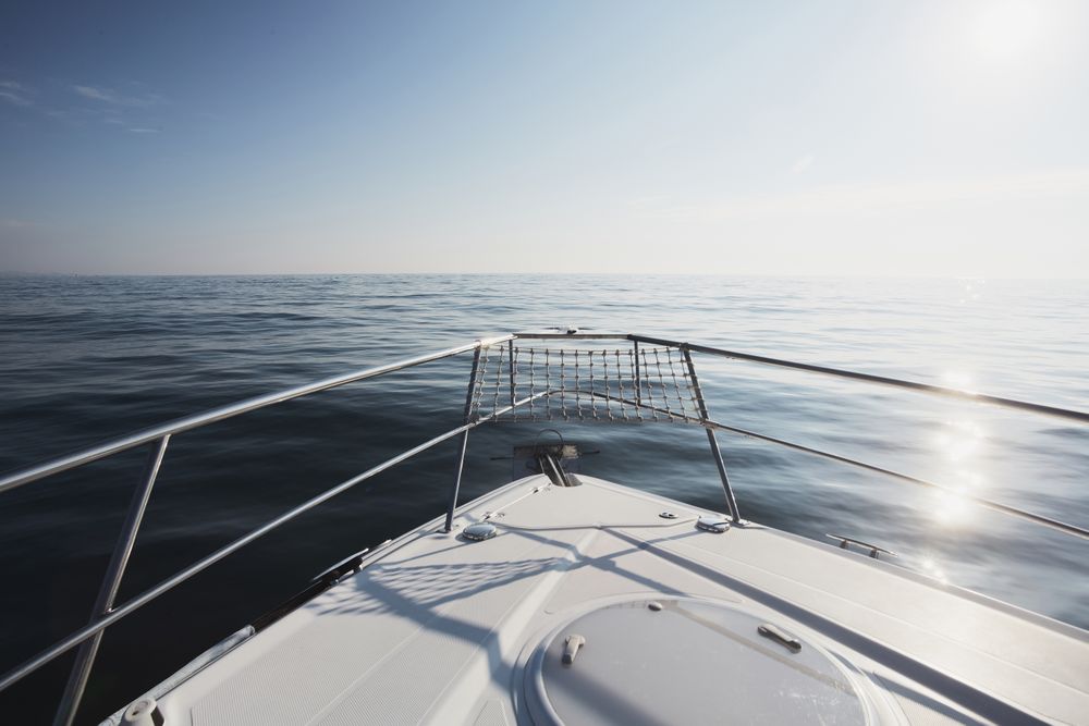 Yacht bow over blue ocean