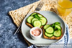Healthy lunch with toasts and cucumber 0Ldj7D