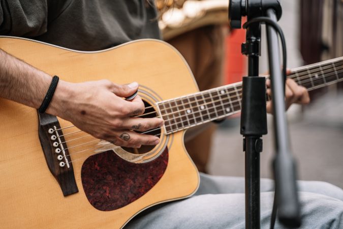Male musician performing in the street