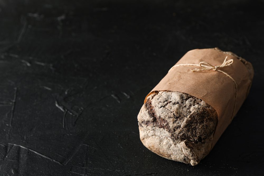Rye bread on background, space for text and closeup