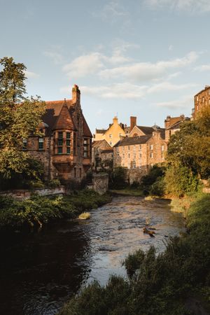 Medieval building next to small river in Scotland