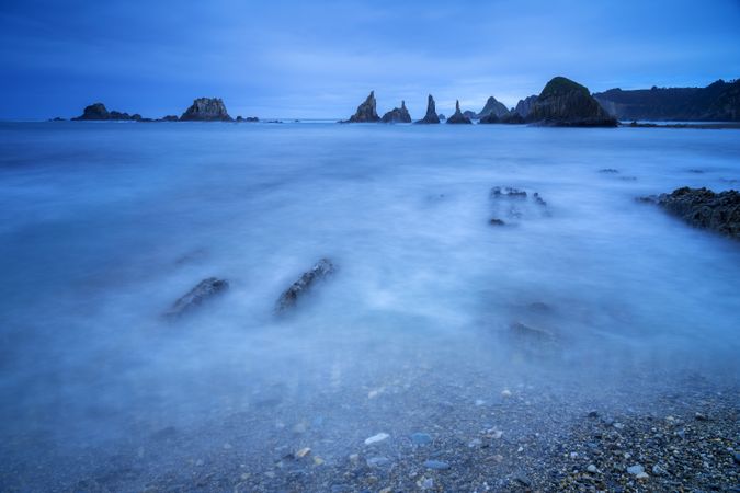 Misty landscape of Playa de Gueirua rock beach