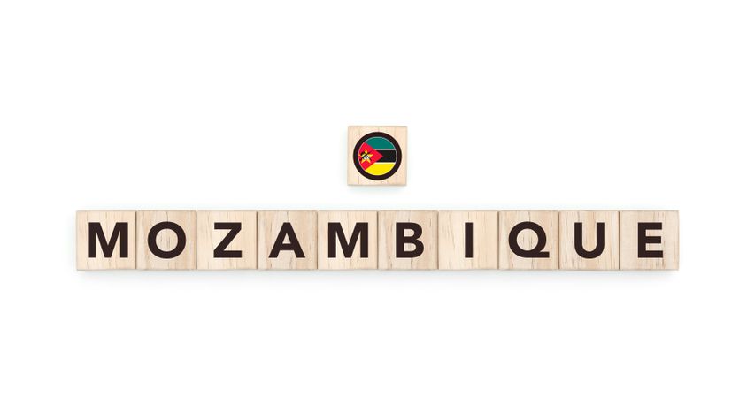 Wooden blocks bearing the name and flag of Mozambique. Mozambican and South African Culture, national identity, travel, and geography in a copy space design.