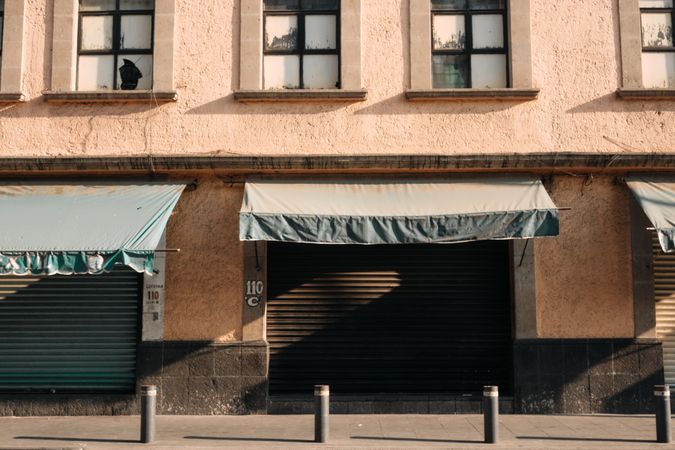 Closed shops with green awning
