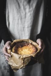 Hands holding cheese cake