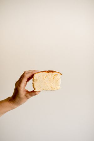 Hand holding tasty banana cake