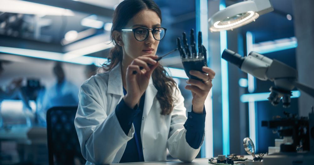 Portrait of a Young Female Scientist Working in Technological Research and Development Company, Assembling Innovative Bionic Prosthetic Hand.