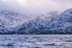 Shore with mountains near water