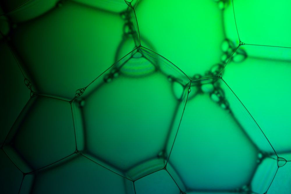 Abstract background bio technology, macro photography foam and water with gradient background. Molecule multicolor backgorund