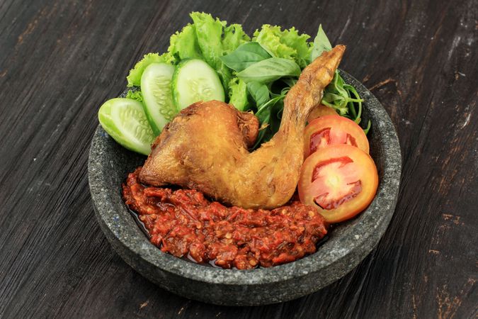 Fried chicken Indonesian dish served with sambal paste