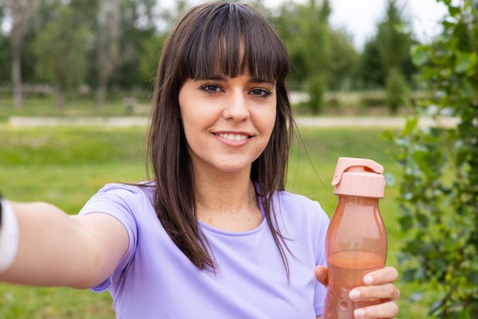 Sport woman taking a selfie on fitness training outdoors