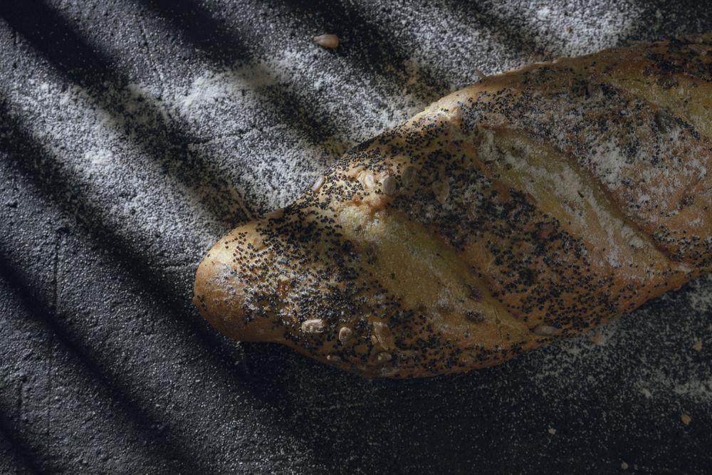 Loaf of bread with grains and poppy seeds